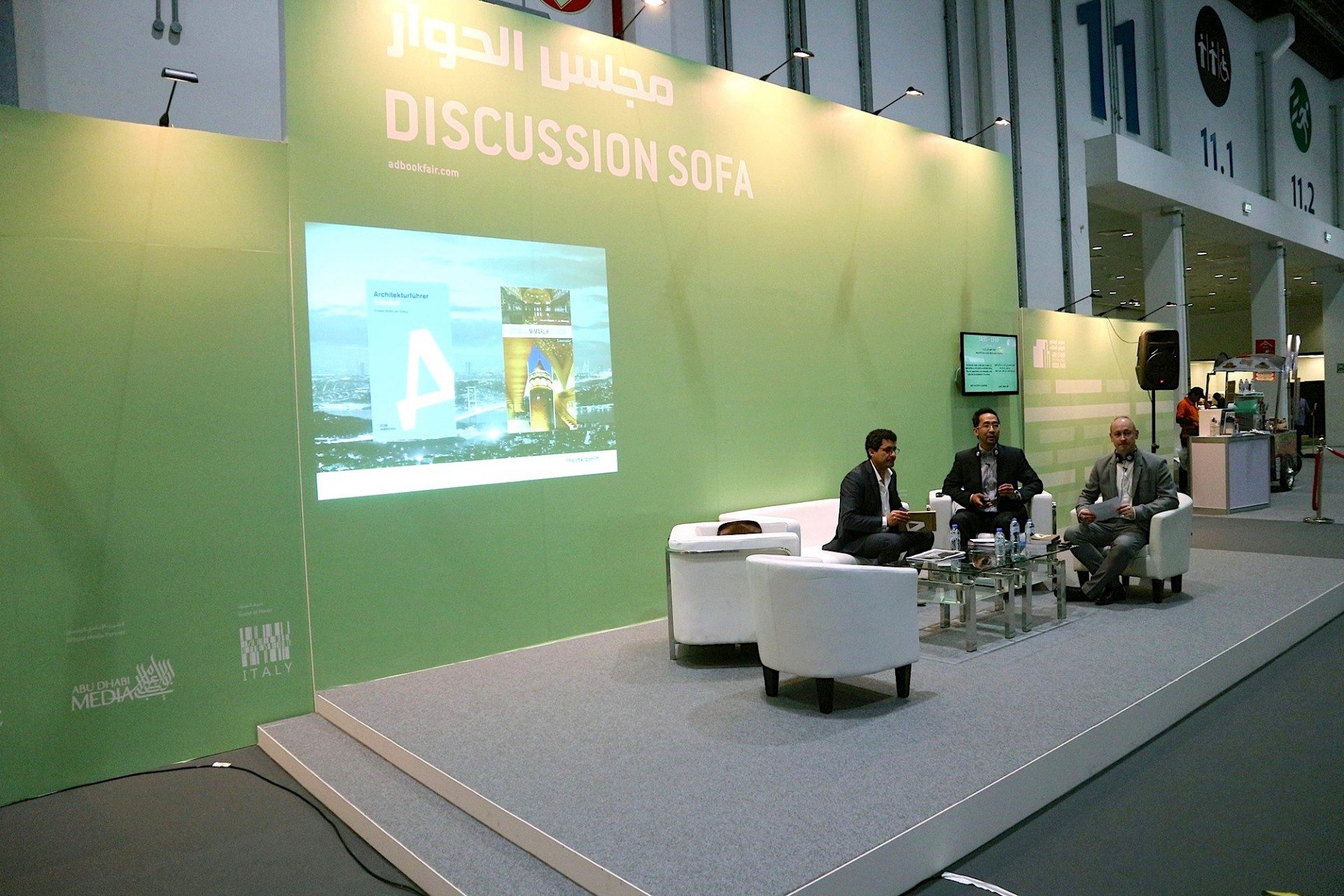 Presentation and publication. At the Discussion Sofa of the ADIBF with host Mustafa Al-Slaiman presenting the Architectural Guide United Arab Emirates with Jan Dimog and Hendrik Bohle.